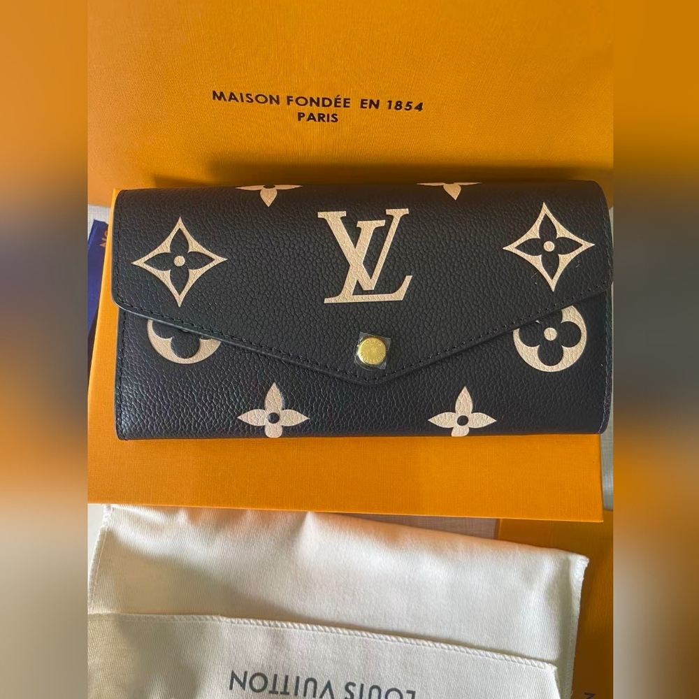 LOUIS VUITTON Monogram Empreinte Leather Sarah Wallet - Picture 2 of 11